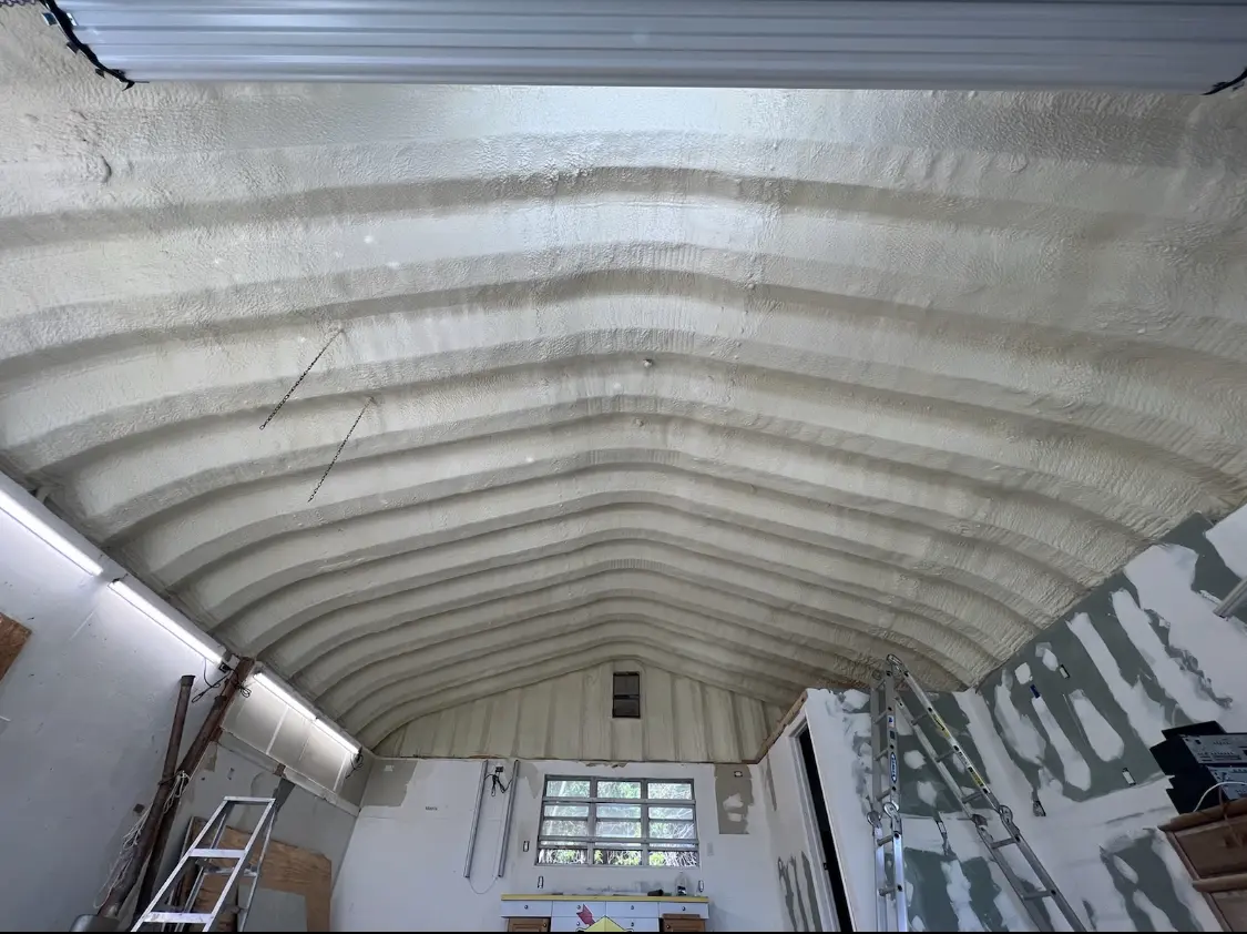 Spray polyurethane foam applied to the underside of a metal roof deck in Blacksburg